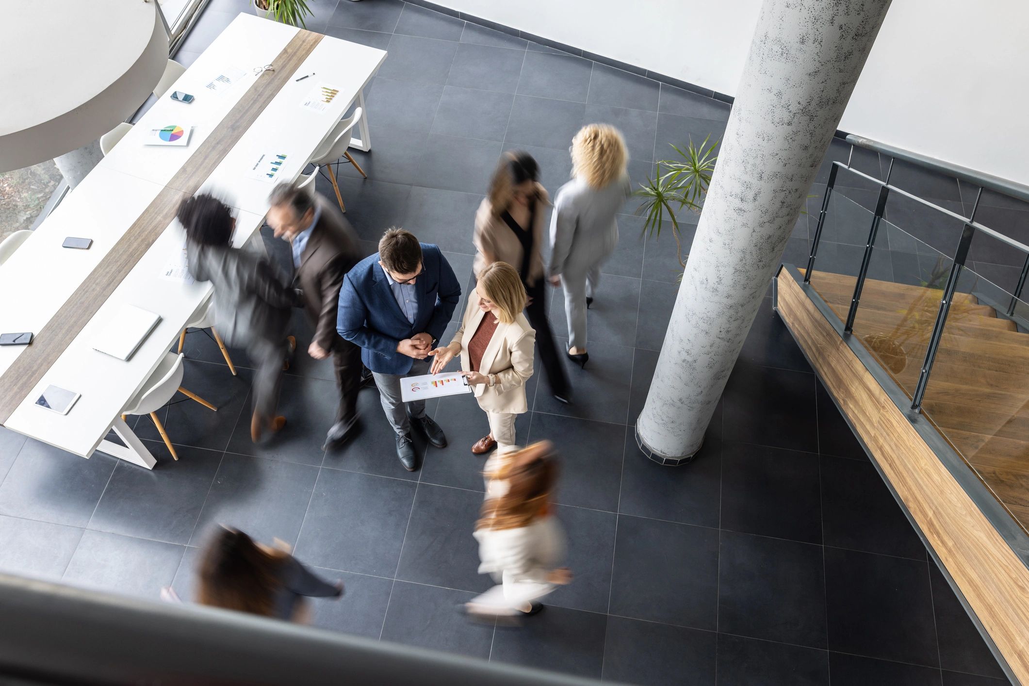 Consultant facilitating a collaborative meeting in a modern office