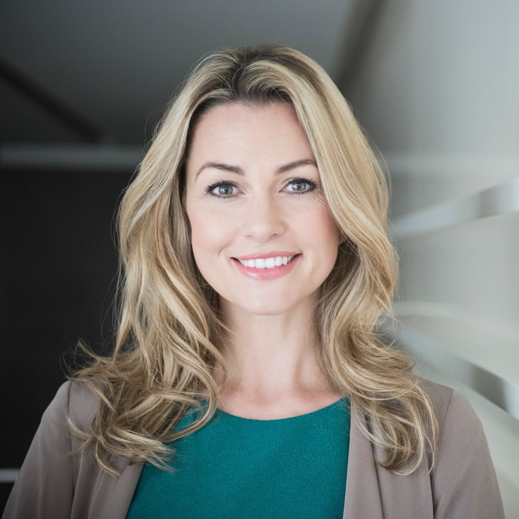 Professional headshot of a smiling woman